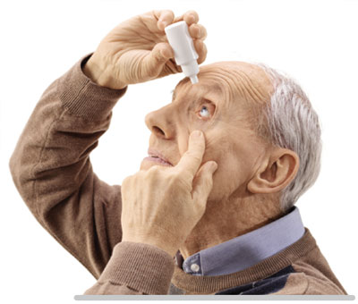 person administering eye drops